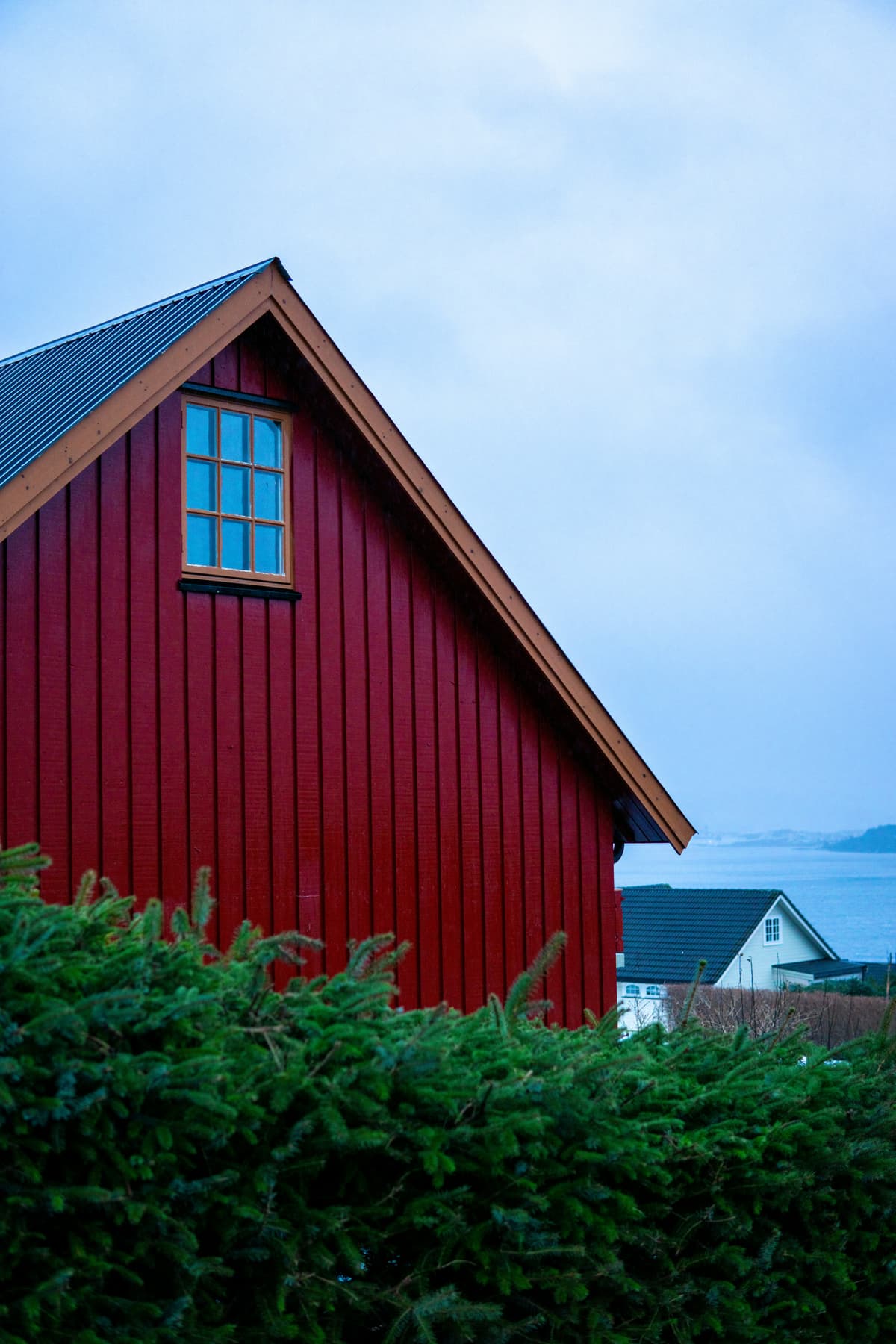 Typical Norwegian home with sloped roof and timber cladding.